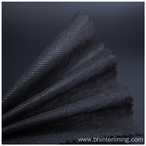 Low temperature fusing polyester paper interlining fabric